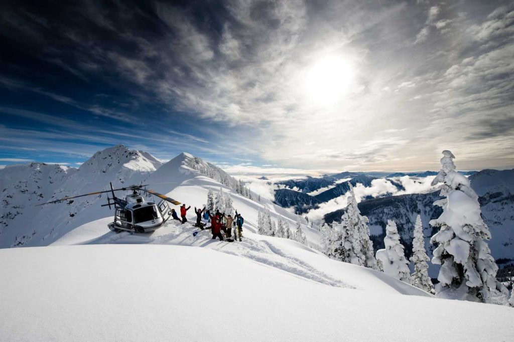 Selkirk Tangiers Helicopter landed above Revelstoke, unloading guests for a heliskiing adventure. 