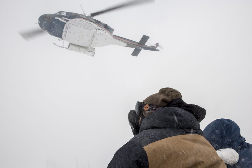 Looking up at the helicopter when skiing at Silvertip Lodge in BC. 